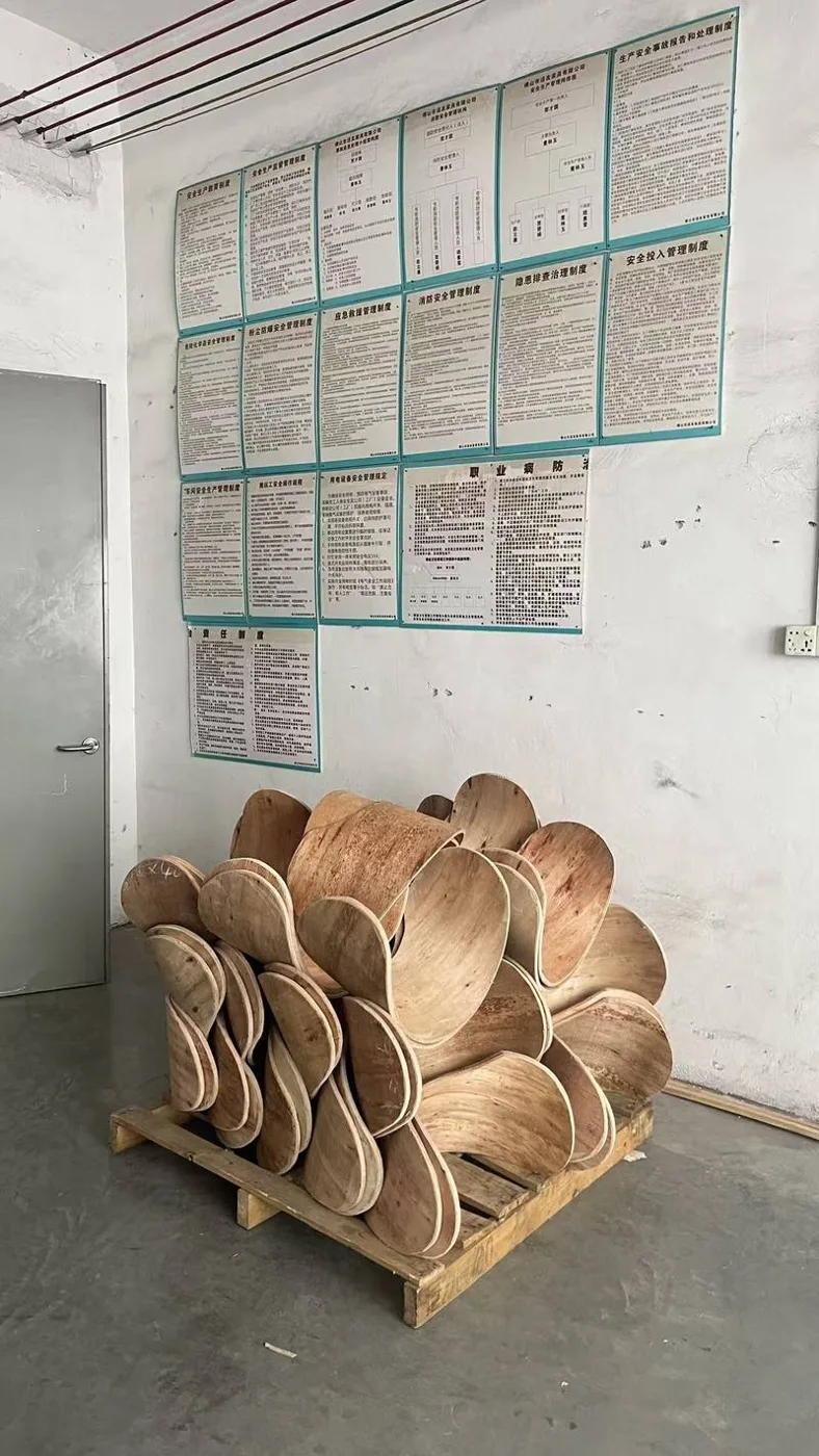 Shaped chair components stored in a workshop